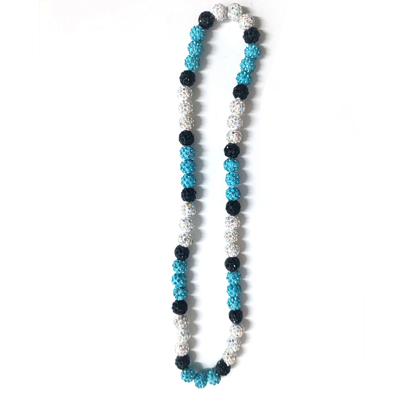 Necklace with blue, black, and silver beads on a white background