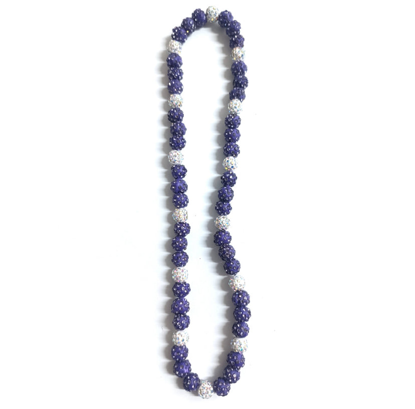 Necklace with purple and white beads on a white background