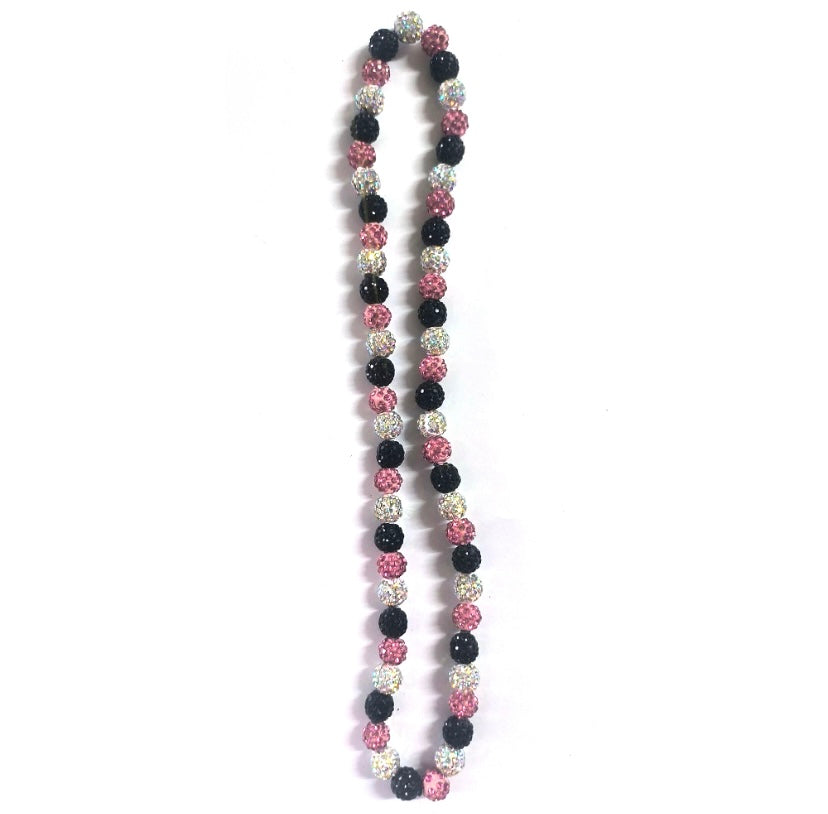 Necklace with black, pink, and silver beads on a white background