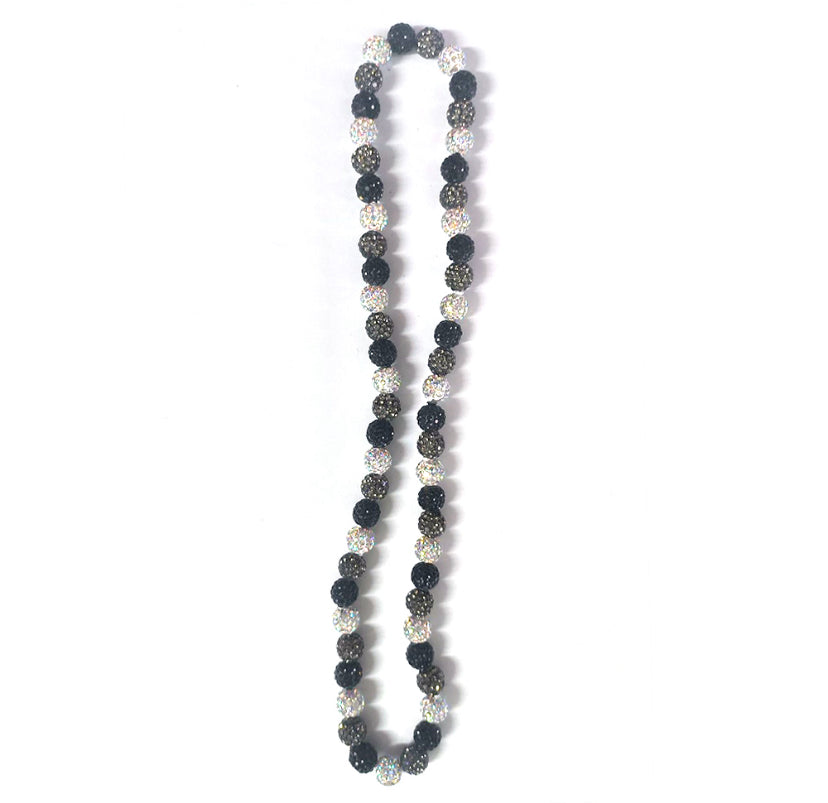 Necklace with black, silver, and gray beads on a white background