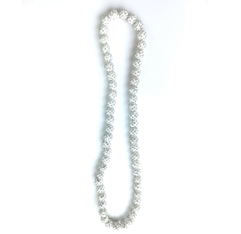 Long pearl necklace on a white background
