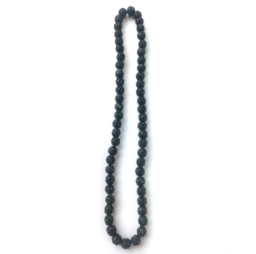 Black beaded necklace on a white background